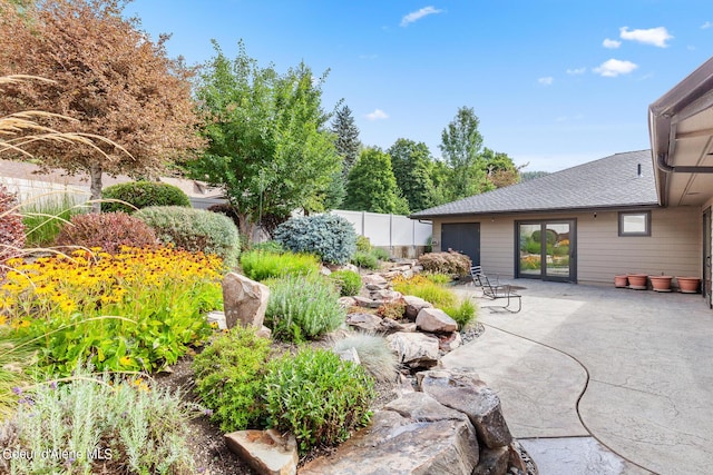 view of yard featuring a patio and fence