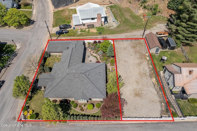 aerial view of property and surrounding area featuring property boundaries highlighted