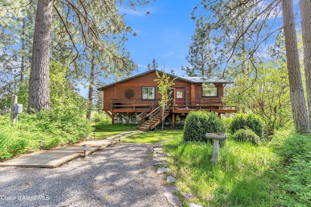 3226 District Two Rd, Bonners Ferry, ID 83805 - view of front facade with stairs and a wooden deck