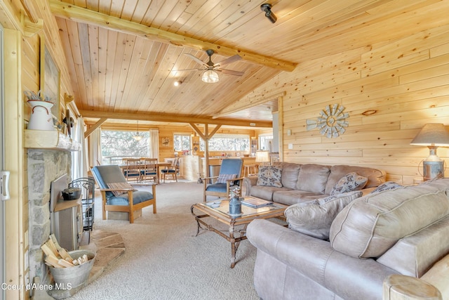 3226 District Two Rd, Bonners Ferry, ID 83805 - living area with carpet flooring, ceiling fan, wood walls, and wooden ceiling
