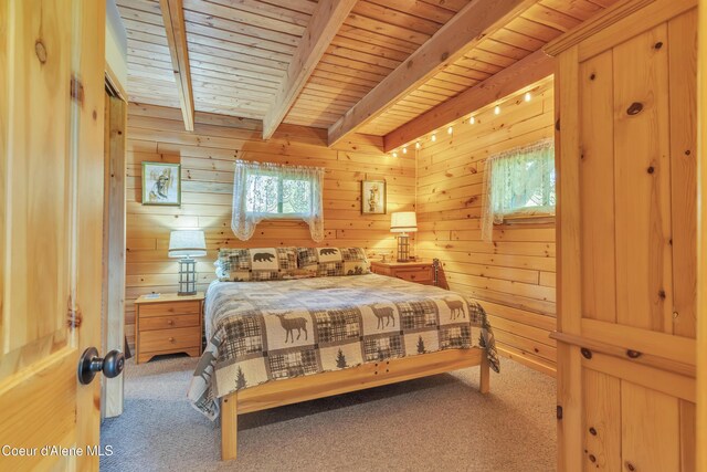 3226 District Two Rd, Bonners Ferry, ID 83805 - bedroom featuring wood ceiling, wood walls, beamed ceiling, and carpet floors