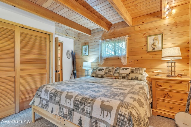3226 District Two Rd, Bonners Ferry, ID 83805 - bedroom featuring a closet, wooden ceiling, carpet, wooden walls, and beamed ceiling