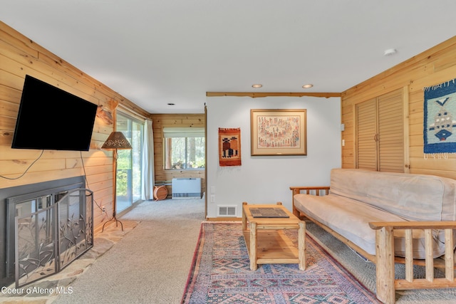 3226 District Two Rd, Bonners Ferry, ID 83805 - living room with recessed lighting, carpet flooring, visible vents, wooden walls, and a fireplace