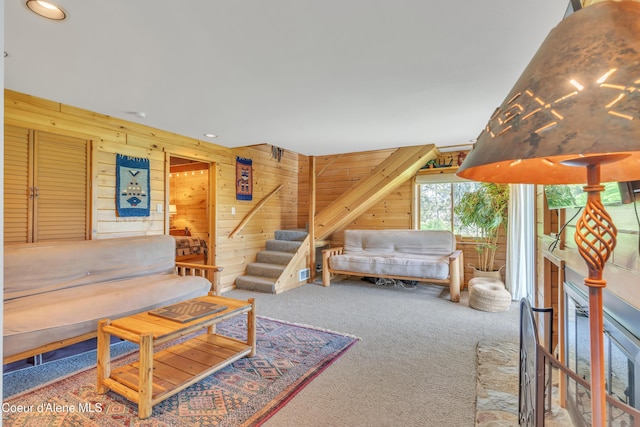 3226 District Two Rd, Bonners Ferry, ID 83805 - living area featuring wood walls, stairs, carpet floors, and recessed lighting