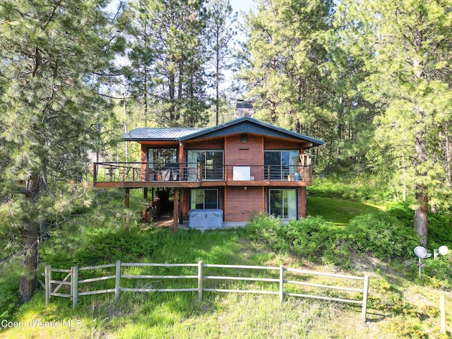 3226 District Two Rd, Bonners Ferry, ID 83805 - back of property with metal roof, a wooden deck, and fence