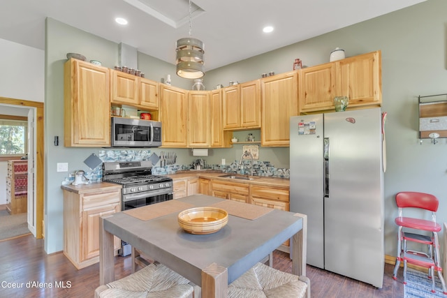 3226 District Two Rd, Bonners Ferry, ID 83805 - kitchen featuring a sink, stainless steel appliances, dark wood-type flooring, light countertops, and light brown cabinetry