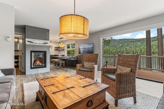 130 Cedar Shls, Sagle, ID 83860 - living room featuring wood finished floors and a warm lit fireplace