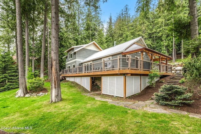 130 Cedar Shls, Sagle, ID 83860 - back of property featuring a wooden deck, a yard, and metal roof