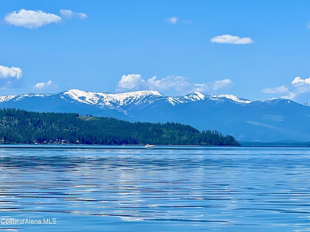 130 Cedar Shls, Sagle, ID 83860 - water view with a mountain backdrop and a heavily wooded area