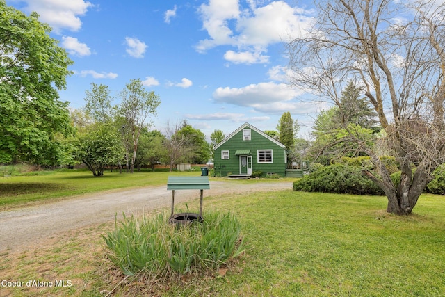 view of home's community featuring a lawn