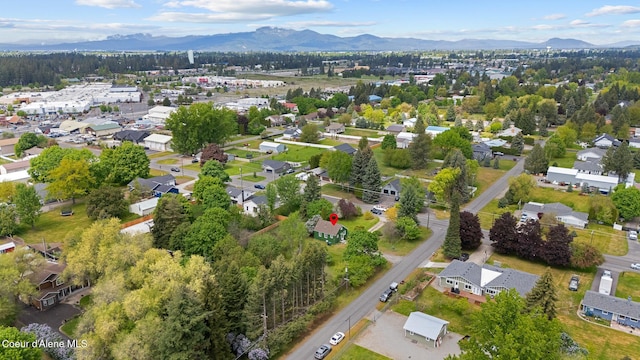 view of property location featuring a mountainous background and nearby suburban area