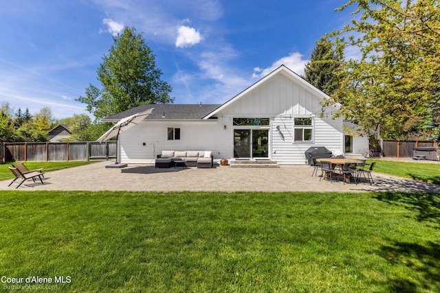 7432 N Davenport St, Dalton Gardens, ID 83815 - back of house featuring outdoor lounge area, board and batten siding, and a patio
