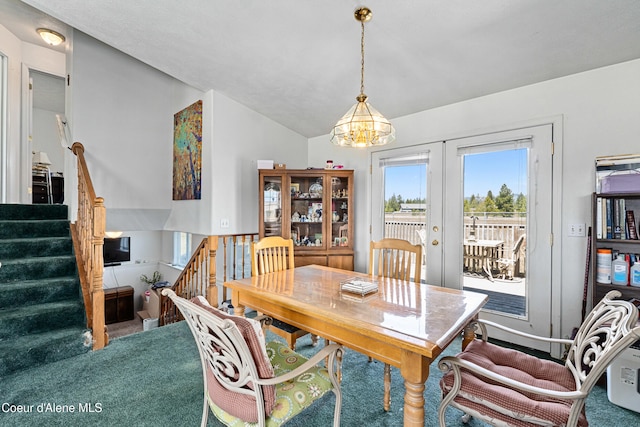 29 Silver Mountain Ln, Oldtown, ID 83822 - dining area with a chandelier, french doors, carpet floors, lofted ceiling, and stairs