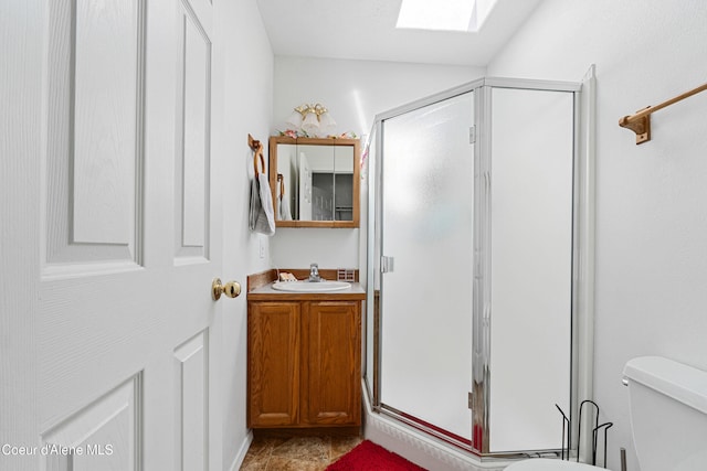 29 Silver Mountain Ln, Oldtown, ID 83822 - full bathroom with a skylight, toilet, a stall shower, and vanity
