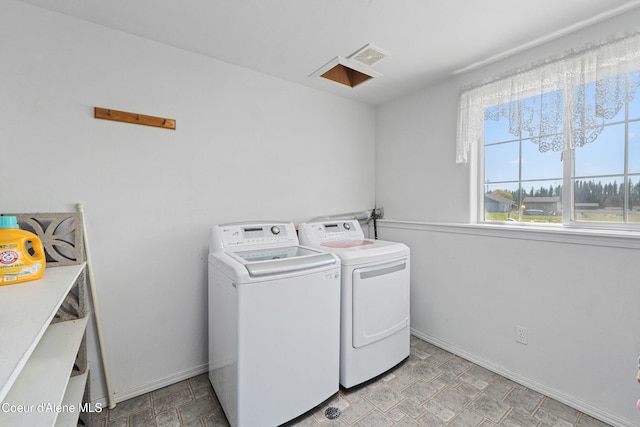 29 Silver Mountain Ln, Oldtown, ID 83822 - washroom featuring washing machine and clothes dryer and baseboards