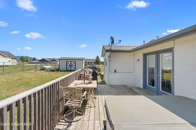 29 Silver Mountain Ln, Oldtown, ID 83822 - deck featuring a storage unit, french doors, and an outdoor structure