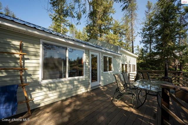 24010 N Bridge Lake Rd, Rathdrum, ID 83858 - wooden terrace featuring outdoor dining space