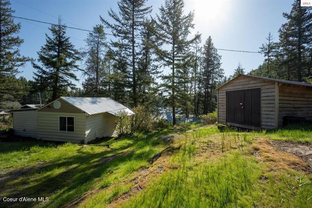 24010 N Bridge Lake Rd, Rathdrum, ID 83858 - view of yard featuring an outbuilding and a shed