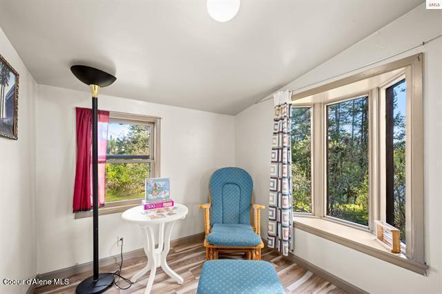 24010 N Bridge Lake Rd, Rathdrum, ID 83858 - sitting room featuring wood finished floors and baseboards