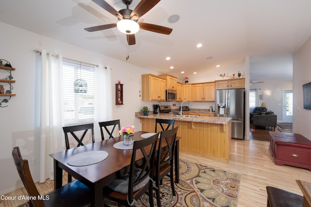 dining area featuring plenty of natural light, ceiling fan, light wood-type flooring, recessed lighting, and lofted ceiling