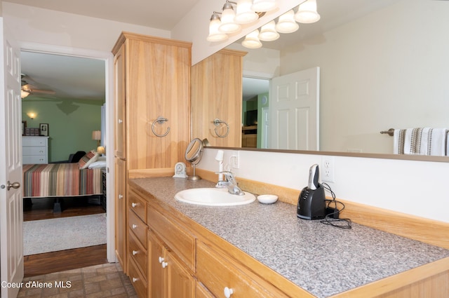bathroom with vanity and a ceiling fan