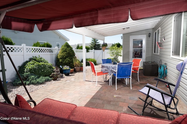view of patio / terrace featuring outdoor dining area and a fenced backyard