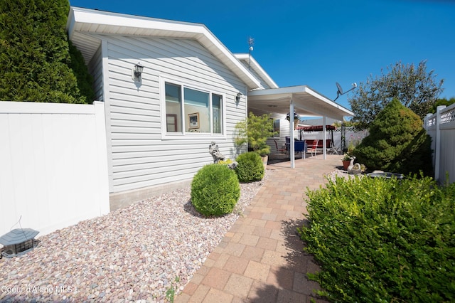 back of house with a patio and a fenced backyard