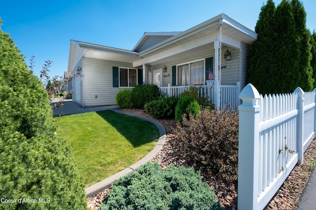 single story home featuring covered porch