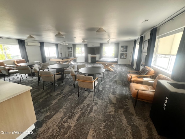 carpeted dining space with a fireplace