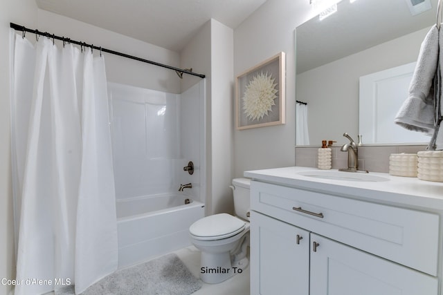 717 N Creative Way, Post Falls, ID 83854 - bathroom featuring vanity, toilet, backsplash, and shower / tub combo