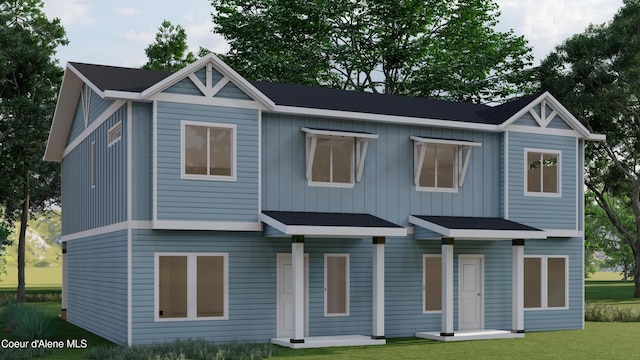 717 N Creative Way, Post Falls, ID 83854 - view of front of home with a front lawn and board and batten siding