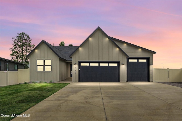 view of front facade featuring concrete driveway, a garage, and board and batten siding