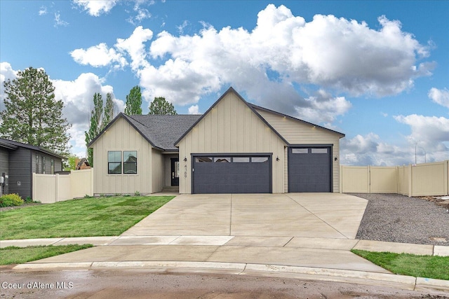view of front of home with a garage, concrete driveway, board and batten siding, and a gate
