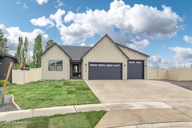 view of front facade featuring driveway, an attached garage, and board and batten siding