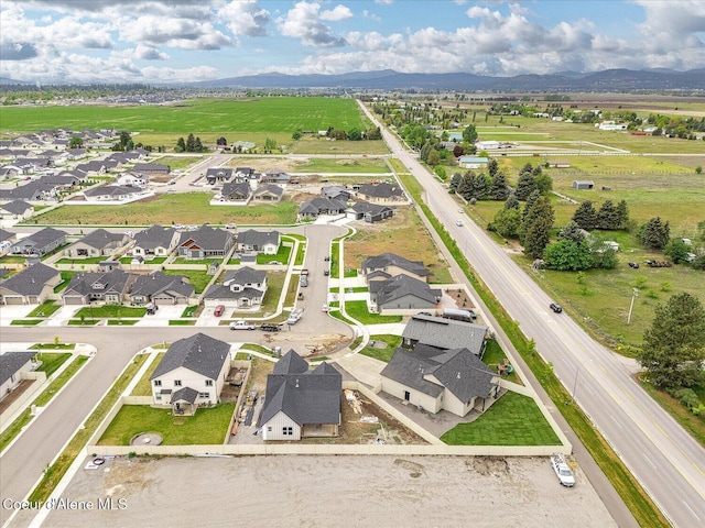 aerial overview of property's location with mountains and nearby suburban area