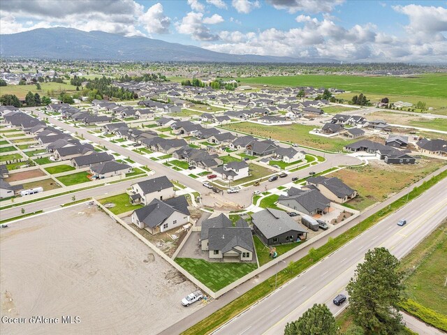 aerial view of residential area with a mountainous background