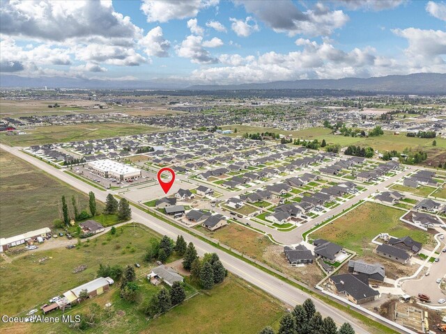 aerial view of property's location featuring mountains