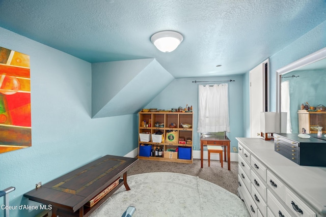 610 W Emma Ave, Coeur Dalene, ID 83814 - rec room featuring a textured ceiling, carpet flooring, and baseboards