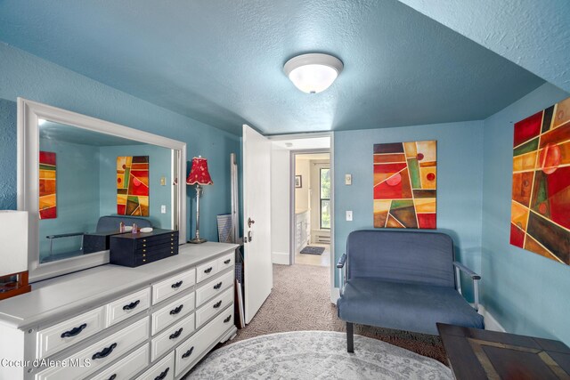 610 W Emma Ave, Coeur Dalene, ID 83814 - living area with a textured ceiling, carpet, and baseboards