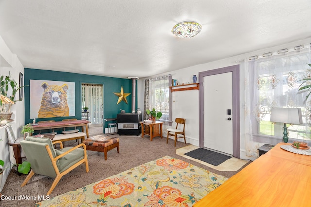 610 W Emma Ave, Coeur Dalene, ID 83814 - living area featuring carpet floors and a textured ceiling