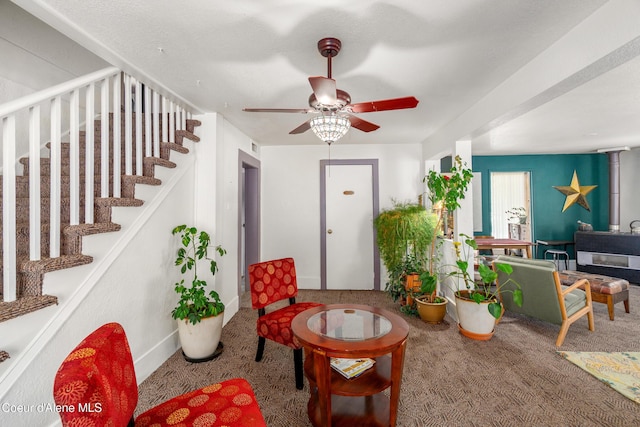610 W Emma Ave, Coeur Dalene, ID 83814 - living area with carpet floors, stairway, and a ceiling fan