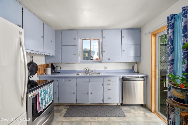 610 W Emma Ave, Coeur Dalene, ID 83814 - kitchen featuring stainless steel appliances, a sink, and light countertops