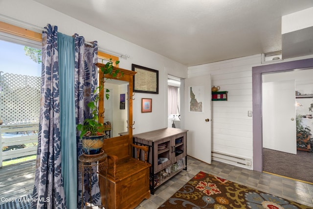 610 W Emma Ave, Coeur Dalene, ID 83814 - foyer with a baseboard heating unit and wood walls