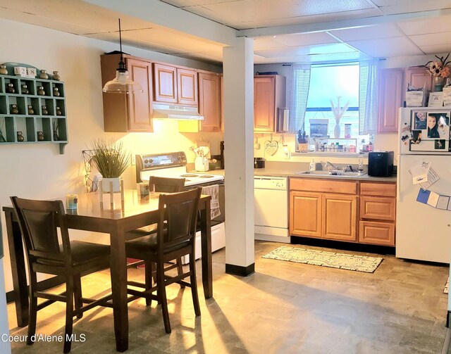 610 W Emma Ave, Coeur Dalene, ID 83814 - kitchen with white appliances, a drop ceiling, under cabinet range hood, light countertops, and a sink