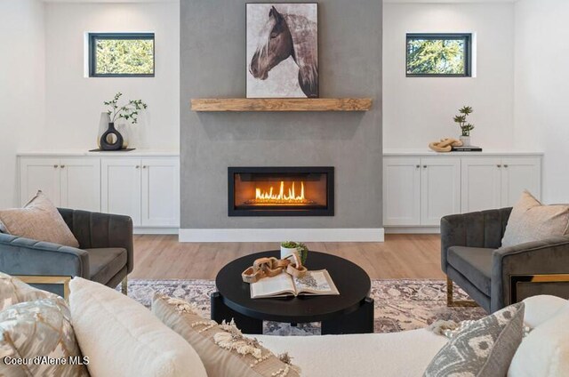 624 Satchel Dr, Spirit Lake, ID 83869 - living area with light wood-type flooring and a fireplace