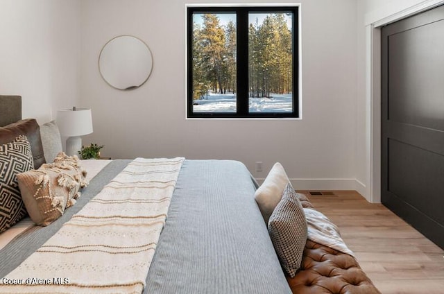 624 Satchel Dr, Spirit Lake, ID 83869 - bedroom with wood finished floors and baseboards