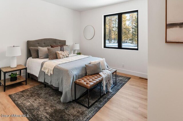624 Satchel Dr, Spirit Lake, ID 83869 - bedroom featuring light wood-style floors and baseboards