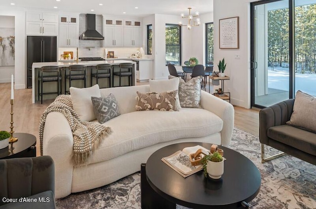 624 Satchel Dr, Spirit Lake, ID 83869 - living room featuring a chandelier, plenty of natural light, light wood-style floors, and recessed lighting