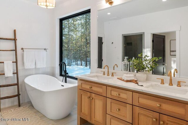 624 Satchel Dr, Spirit Lake, ID 83869 - full bathroom with a freestanding bath and double vanity