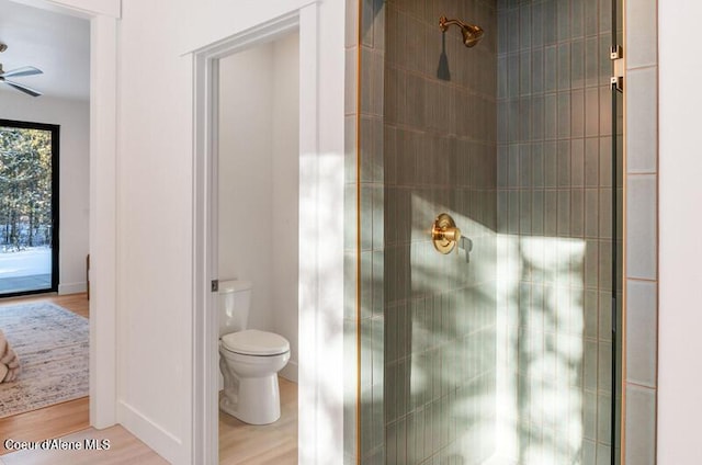 624 Satchel Dr, Spirit Lake, ID 83869 - full bath featuring a shower stall, toilet, wood finished floors, and ceiling fan